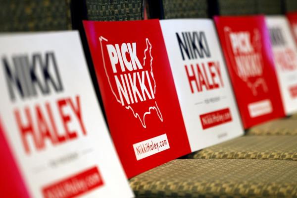 Signs are seen on chairs before US Republican presidential hopeful and former UN Ambassador Nikki Haley speaks at a rally in Troy, Michigan, on February 25, 2024.