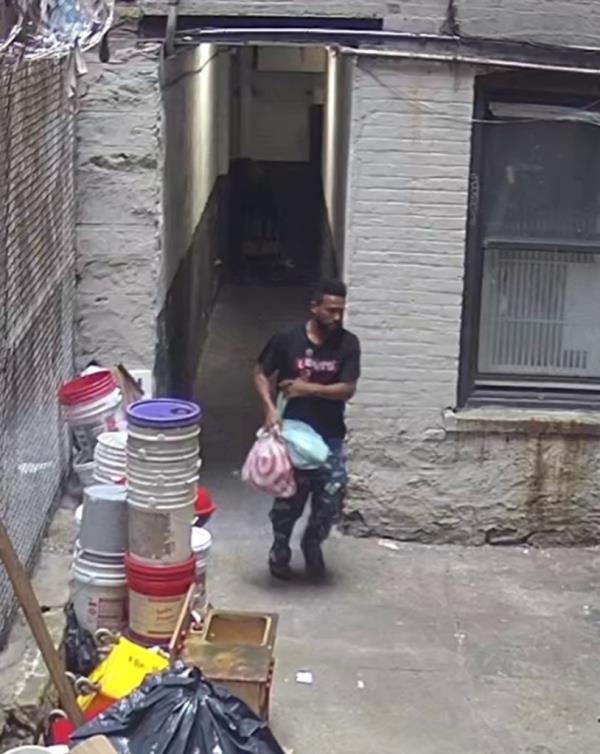 A surveillance camera screengrab of Felix Garcia fleeing the day care. 