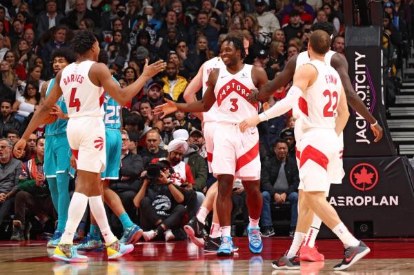 OG Anunoby #3 of the Toro<em></em>nto Raptors celebrates during a game against the Charlotte Hornets.