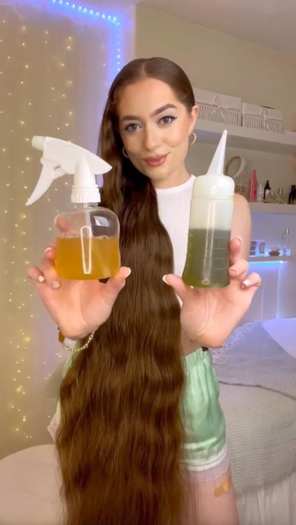 Jasmin Larsen with her rosemary oil and water spritz. 
