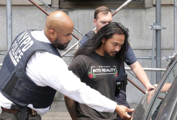 Judd Sanson led to court by police. 