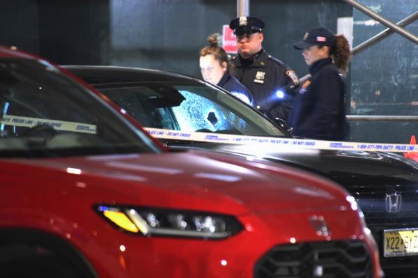 car with bullet hole through windshield