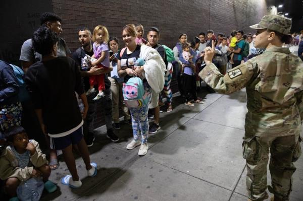 Migrants are seen arriving on a bus at the Port Authority Bus Terminal in Manhattan, Monday, Aug. 14, 2023. 
