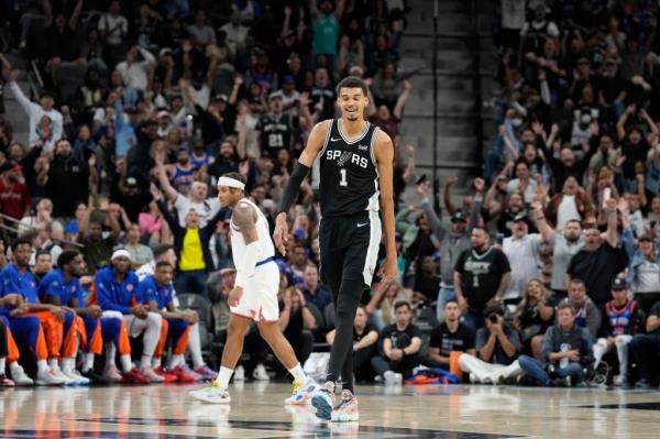 San Anto<em></em>nio Spurs forward Victor Wembanyama (1) reacts after scoring a three point basket in overtime against the New York Knicks at Frost Bank Center. 