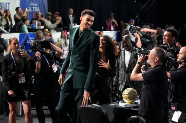 Victor Wembanyama reacts after being selected first overall by the San Anto<em></em>nio Spurs during the NBA basketball draft.