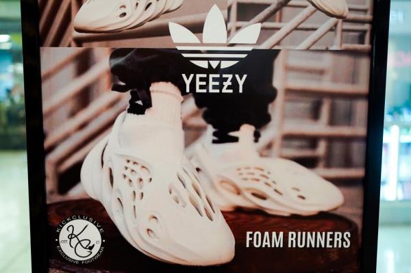 A sign advertises Yeezy shoes