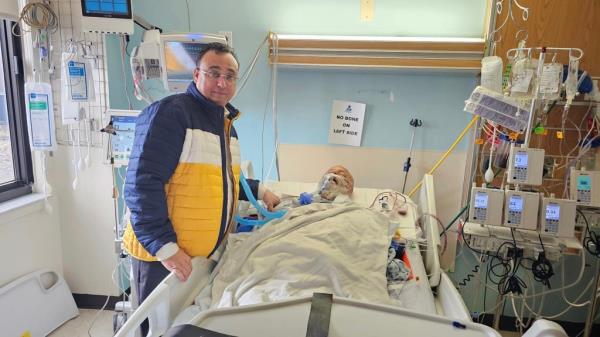 Jasmer Singh, 66, seen in a hospital bed.
