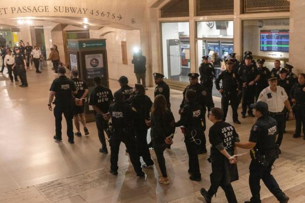 Protesters in zip cuffs.