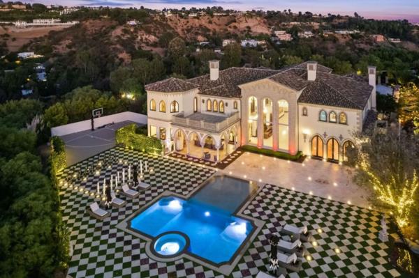 Aerial of the pooled backyard.