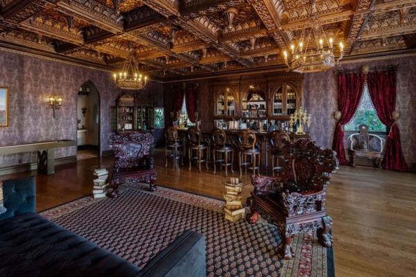 A high-ceilinged bar and lounge area in the home.