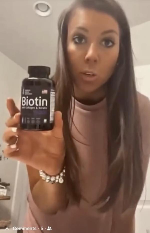 TikTok cancer scammer seen with a co<em></em>ntainer of Biotin pills 
