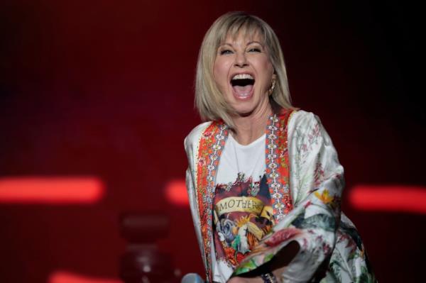 Photo of Olivia Newton-John smiling.