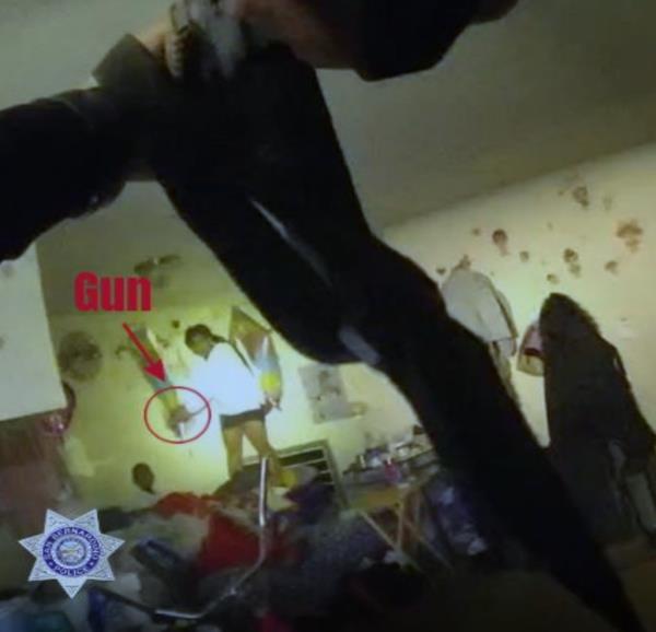 The San Bernardino Police Department has released an image from a body camera video showing Darvet Brown pointing a gun at the head of her friend's 3-year-old son