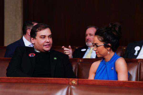 Former Republican Representative from New York George Santos (L) chats with US Representative Lauren Boebert (R-CO) (R) ahead of US President Joe Biden's third State of the Unio<em></em>n address.