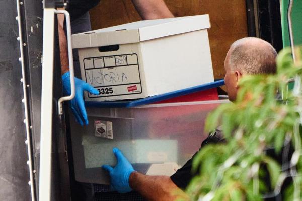 Investigators collect evidence at the Massapequa home of Heuermann following his arrest in July, 2023.