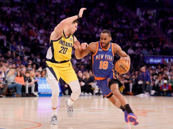 New Knick Alec Burks, who scored 22 points, drives on Doug McDermott during their 125-111 loss to the Pacers.