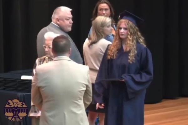 The father of a graduate at Baraboo High School in Wisco<em></em>nsin rushed to the stage as his daughter was walking across to receive her diploma, and forcibly pushed the district's superintendent away from the ceremony as she approached him