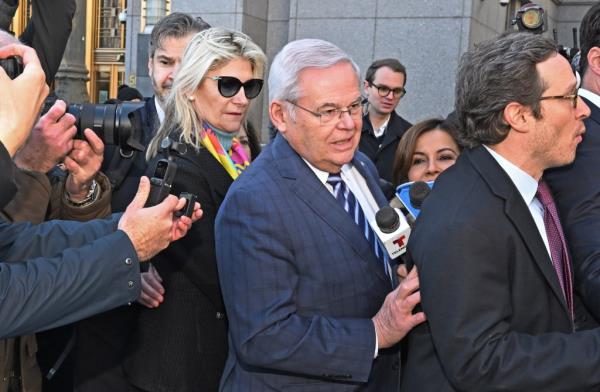 Senator Bob Menendez and his wife Nadine (pictured) leave federal court after being charged .