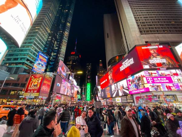 Group of people gathering in Times Square, New York City, on November 19, 2023