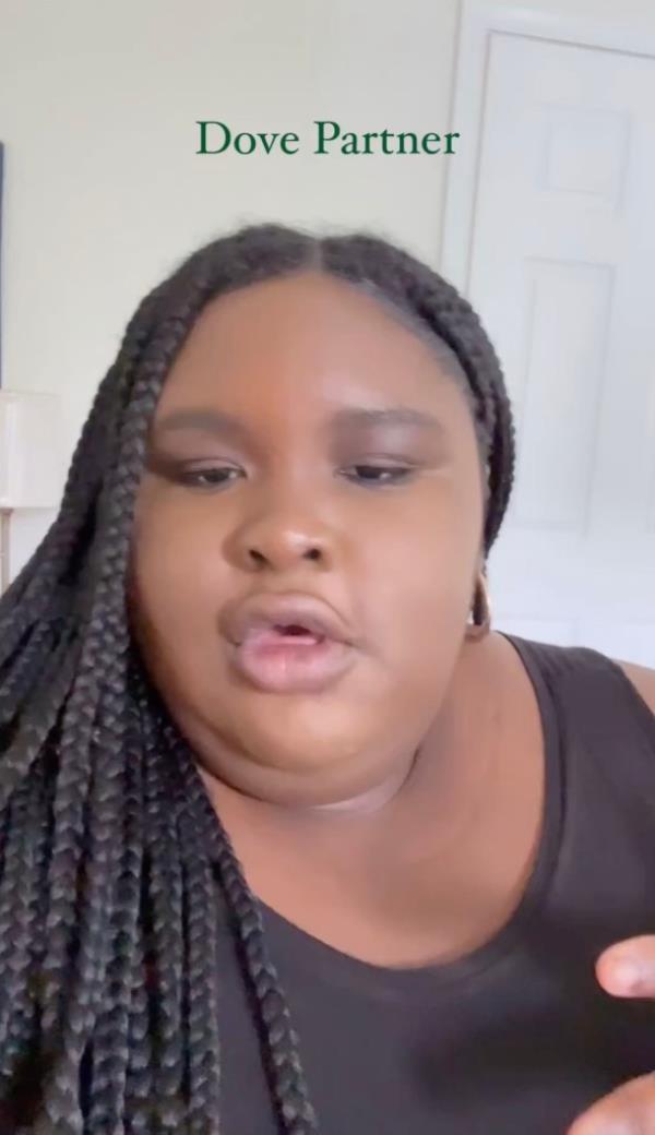 Bryant is pictured in a screengrab of the video announcing her partnership with Dove Beauty.