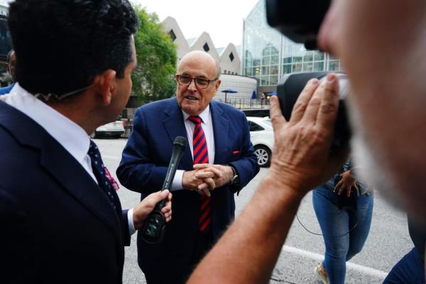 Rudy Giuliani walks into the Fulton County Courthouse in Georgia to testify before a special grand jury. Giuliani is a target of the o<em></em>ngoing criminal investigation into Georgia’s 2020 elections.