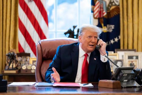 In this image released in the final report by the House committee investigating the Jan. 6 attack on the U.S. Capitol, President Do<em></em>nald Trump talks on the phone to Vice President Mike Pence from the Oval Office of the White House on the morning of Jan. 6, 2021.