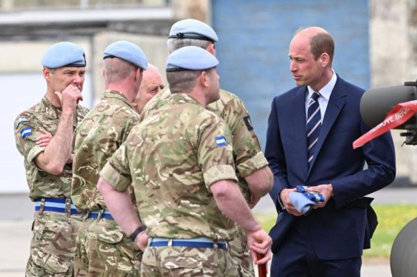 King Charles III passing the role of co<em></em>lonel-in-Chief of the Army Air Corps to Prince William in a formal military ceremony