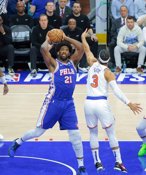 76ers center Joel Embiid (21) is defended by the Knicks' Josh Hart (3) in Game 6.