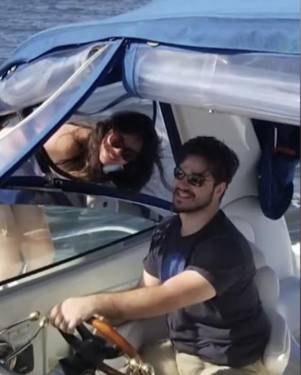 David and Ana riding a boat.
