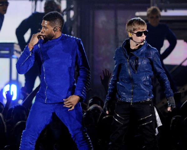 2011: Usher and Justin Bieber perform o<em></em>nstage uring the 53rd Grammy Awards at the Staples Center in LA.