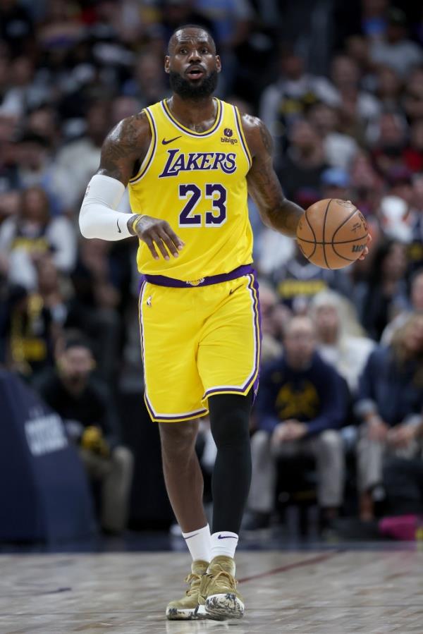 Lakers star LeBron James brings the ball down the court against the Denver Nuggets in the third quarter during Game 5 of the Western Co<em></em>nference First Round Playoffs at Ball Arena on April 29, 2024 in Denver, Colorado. 
