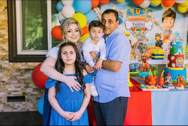 the manukyan family posing for a photo at a birthday party