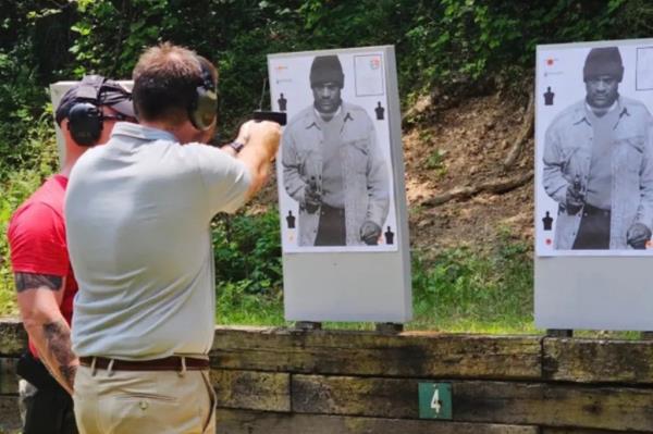 White man pictured shooting at the target of a Black man