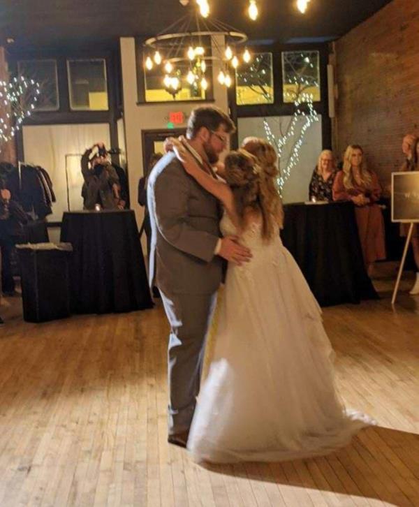 The blushing bride and her sister do<em></em>nned an all-white dress for the occasion while Bowling opted for a grey suit and orange tie. 