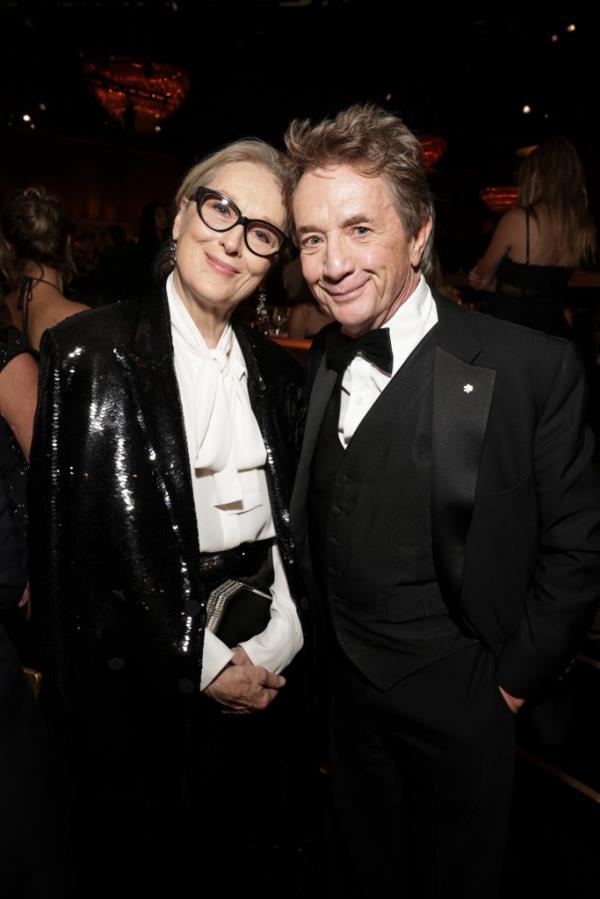 Meryl Streep and Martin Short at the 81st Annual Golden Globes, smiling. 