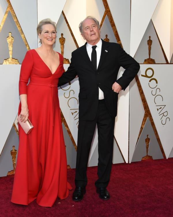 Meryl Streep smiling with Don Gummer in 2018. 