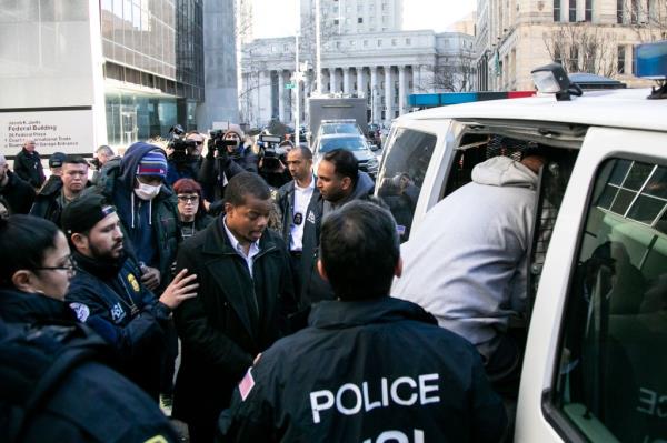 Law enforcement officers transporting defendants who allegedly took bribes as NYCHA employees on Feb. 6, 2024.