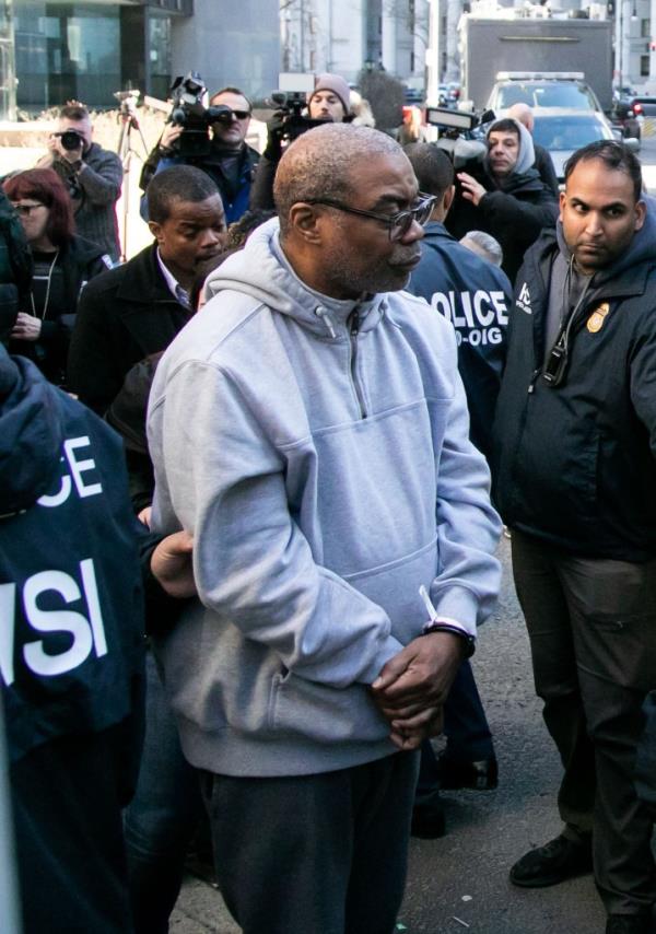 Law enforcement transport arrested suspects in co<em></em>nnection with NYCHA bribery and extortion at 26 Federal Plaza, NYC, in a police vehicle.