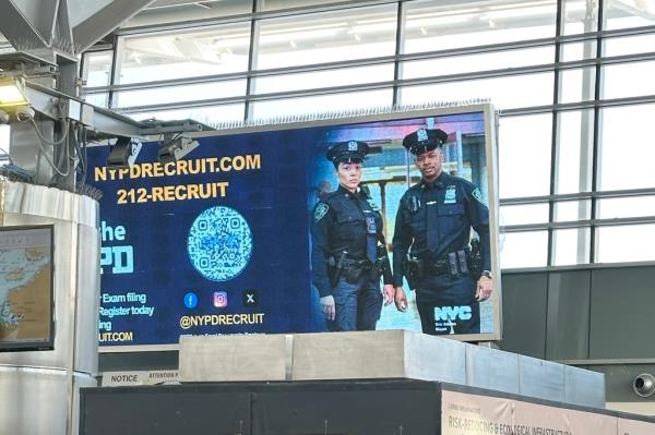 Billboard shows Police Officer Alvarez and an unknown police officer.