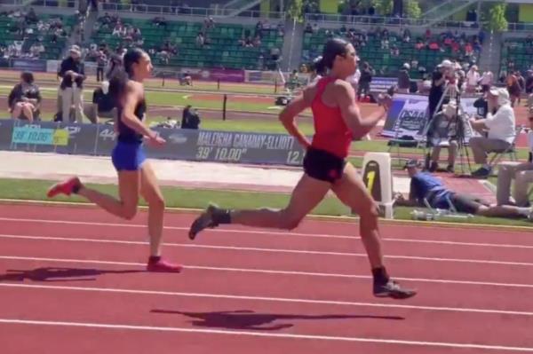 Transgender high school runner Aayden Gallagher being crowned as the Oregon Girls’ 6A 200-meter state champion on a running track