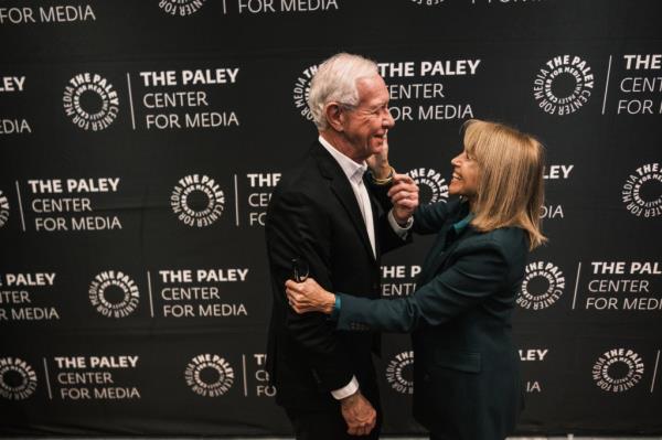 Chesley Sullenberger and Katie Couric embracing on the red carpet