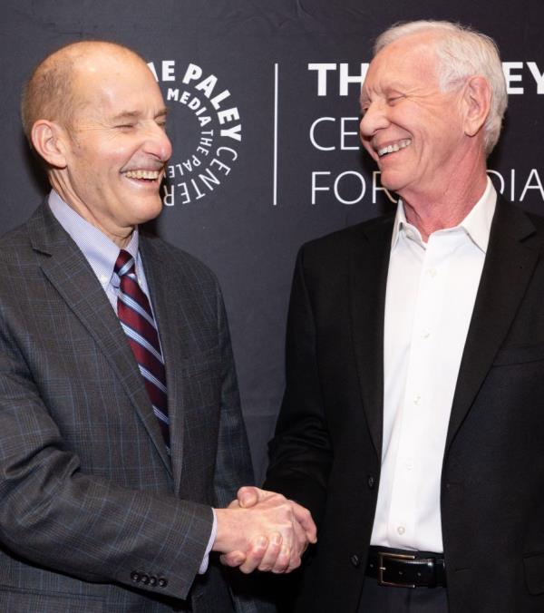 Jeff Skiles and Chesley Sullenberger shaking hands on the red carpet