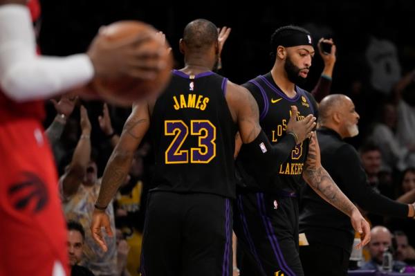 Anthony Davis and LeBron James celebrate for the Lakers.