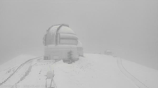 Mauna Kea Weather Center in Hawaii covered in snow