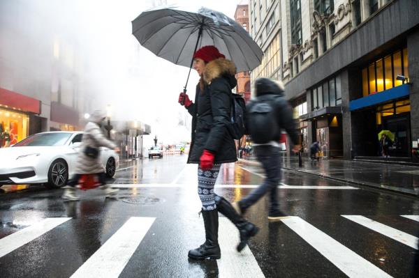 Winter walks in New York City - Woman crossing the street.