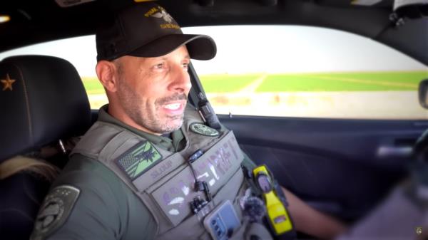 Deputy Frank Sloup in the seat of his cruiser