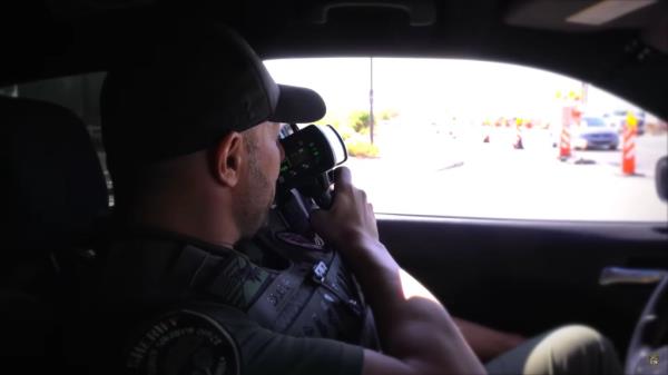 Deputy Frank Sloup uses a speed gun