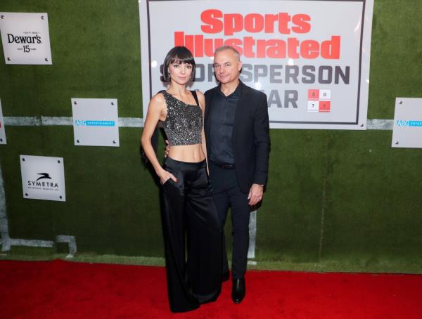 Emilia and James Heckman standing together at a 2019 Sports Illustrated event.