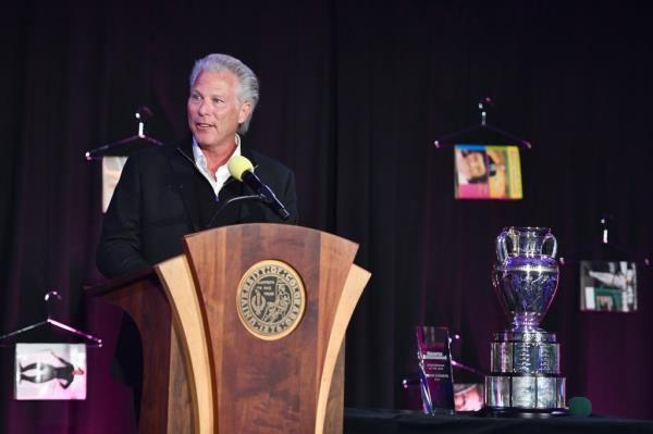 Ross Levinsohn speaking at a podium.
