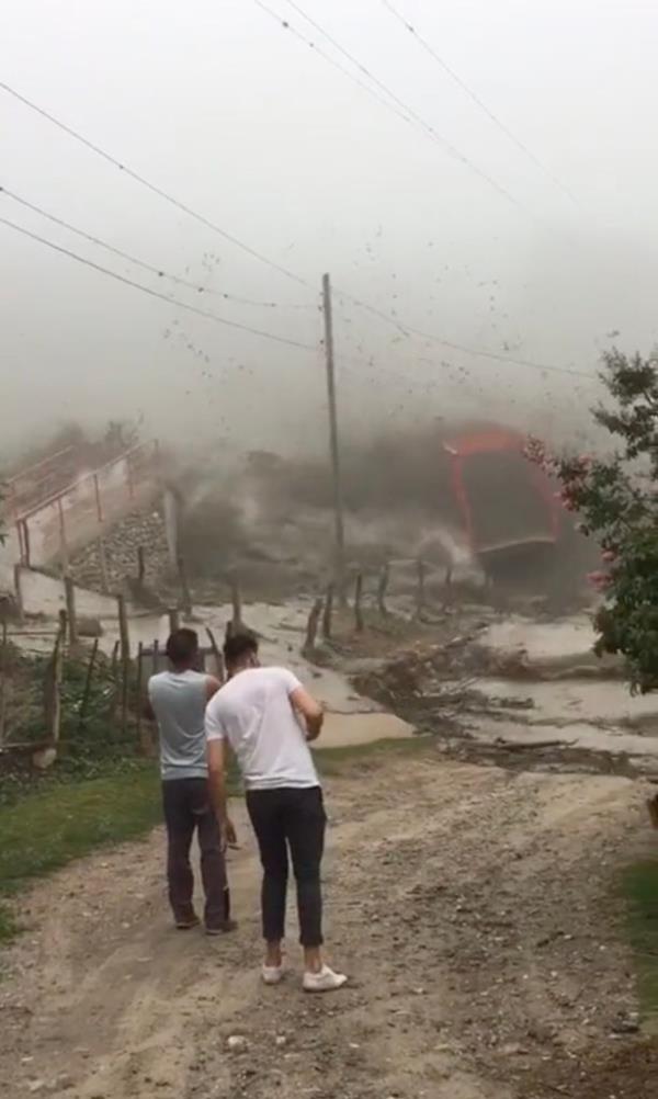 The o<em></em>nly bridge to Argentina's Rincon village was wiped out during a flood surge on Monday.